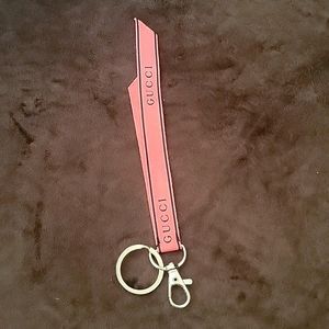 - Gucci perfume ribbon keychain
